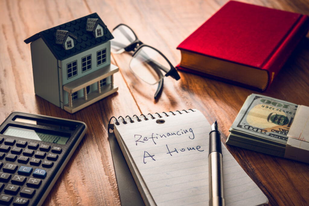 Homeowner calculating refinancing options for a real estate investment